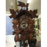 MODERN GERMAN CUCKOO CLOCK WITH CARVED LEAF & BIRD DESIGN