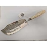 A SILVER WILLIAM IV FISH SLICE WITH MOP HANDLE FULLY H/M FOR LONDON 1835 WITH MAKERS MARK WK BEING