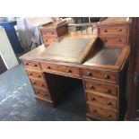 EDWARDIAN MAHOGANY WOOTON STYLE DESK HINGED WRITING SLOPE & MANY DRAWERS, INSET TOOLED LEATHER TOP