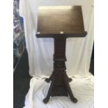 LARGE HEAVILY CARVED OAK CHURCH LECTERN WITH RELIGIOUS SYMBOLS, FINE CLAW LEGS & FEET WITH BRASS