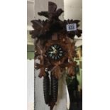 MODERN BLACK FOREST STYLE GERMAN CARVED CUCKOO CLOCK DEPICTING LEAVES & A BIRD