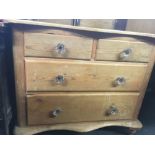 STRIPPED PINE WAVY FRONTED CHEST OF 2 LONG & 2 SHORT DRAWERS WITH GLASS HANDLES, 38'' WIDE