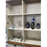 SHELF OF GLASSWARE INCL; DECANTER, VASES, DRINKING GLASSES, CANDLESTICKS ETC & SOME CHINA
