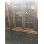 GEORGIAN STYLE STRESSED OAK DISPLAY CABINET WITH CUPBOARD UNDER, ADJUSTABLE SHELVES & BRASS