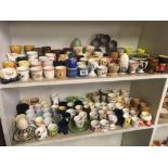 2 SHELVES OF APPROX 150 EGG CUPS & CHINA EGGS