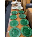 6 GREEN WEDGWOOD LEAF PATTERNED PLATES & 7 FLORAL & BUTTERFLY PATTERNED PLATES, SOME STAPLE MENDED