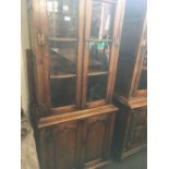 GEORGIAN STYLE STRESSED OAK DISPLAY CABINET WITH CUPBOARD UNDER, ADJUSTABLE SHELVES & BRASS