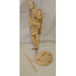 CARVED FIGURE OF MAN WITH MADDOCK, 11'' HIGH