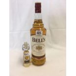 1 ltr BOTTLE OF BELLS EXTRA SPECIAL WHISKY & A WHISKY MINIATURE