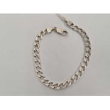 A SILVER FLAT CURB LINK BRACELET