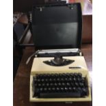 ADLER PORTABLE MANUAL TYPEWRITER WITH CARRY CASE