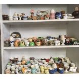 3 SHELVES OF APPROX 250 EGG CUPS, CHINA EGGS ETC