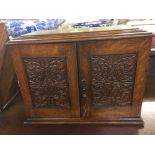 EARLY 20TH CENTURY OAK SMOKERS CABINET WITH 2 DRAWERS, HINGED LID TOBACCO JAR ETC WITH 7 BRIER