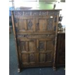 CARVED OAK COLONIAL STYLE DRINKS CABINET WITH ORNATE HINGES & SLIDING SHELF