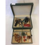 GREEN JEWELLERY BOX WITH MISC CONTENTS, NECKLACES, BROOCHES, BANGLE
