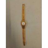 A LADIES GILT WRIST WATCH BY CORONET