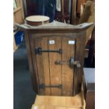 CARVED OAK CORNER WALL CUPBOARD WITH IRON HINGES