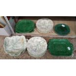 SHELF OF VARIOUS PLATES & DISHES, DARK GREEN WITH LEAF DECORATION