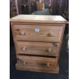 NARROW STRIPPED PINE BEDSIDE CHEST OF 3 DRAWERS
