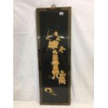 ORIENTAL BLACK LACQUER PANEL WITH APPLIED SHELL DECORATION IN THE FORM OF A VASE OF FLOWERS IN