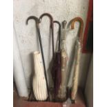 2 VINTAGE WALKING STICKS, 3 VINTAGE UMBRELLAS & A TALL POTTERY VASE