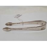 A PAIR OF ANTIQUE SILVER SUGAR TONGS