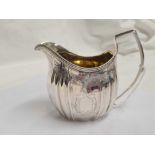 A GEORGE III SILVER CREAM JUG,