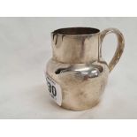 A SILVER CREAM JUG WITH HOOP HANDLE,