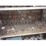 SHELF OF CUT GLASS GLASSES & DECANTERS