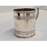 A GEORGE III SILVER MUG WITH REEDED BANDS,