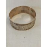 A SILVER NAPKIN RING WITH VACANT APITURE, B'HAM 1901