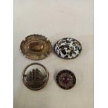 FOUR VICTORIAN SILVER MOUNTED BROOCHES