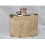 A SILVER HIP FLASK OF CURVED OUTLINE