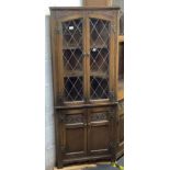 COLONIAL STYLE OAK CORNER CABINET / DISPLAY CABINET WITH LEADED GLASS DOORS TO TOP, 27'' WIDE