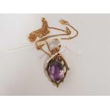AN AMETHYST PENDANT SET IN 9ct ON FINE GOLD CHAIN