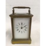 BRASS BODIED CARRIAGE CLOCK WITH STRIKING MECHANISM WITH PRESENTATION INSCRIPTION