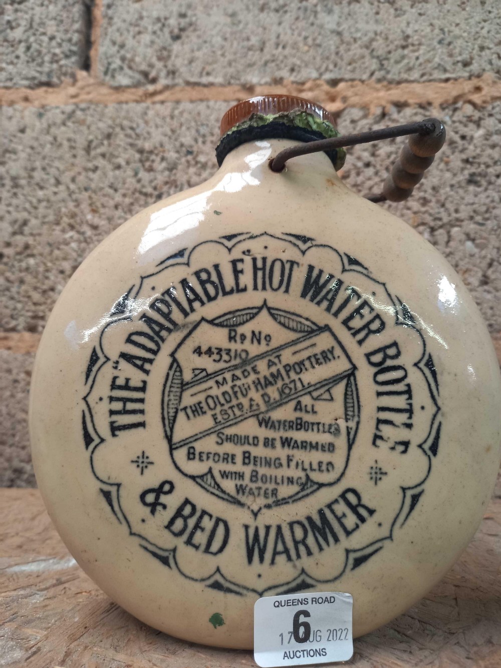 ROUND STONEWARE HOT WATER BOTTLE BY HOLMAN, HAM & COMPANY,