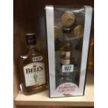 HALF BOTTLE OF BELLS SCOTCH WHISKY & A MINIATURE WITH GLASS