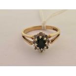 A SAPPHIRE & DIAMOND OVAL CLUSTER SET 9ct RING,