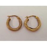 A PAIR OF 9ct SNAKE SHAPED EARRINGS