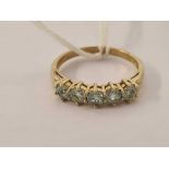 A 5 STONE ACQUAMARINE RING SET IN 9ct,