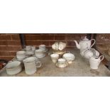 SHELF WITH CUPS & SAUCERS & A JUG COMMEMORATING QUEENS GOLDEN JUBILEE PART TEA SET BY AYNSLEY &