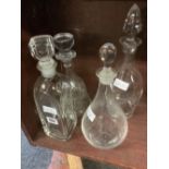 4 VARIOUS GLASS DECANTERS