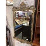 ORNATE BRASS FRAMED MIRROR,