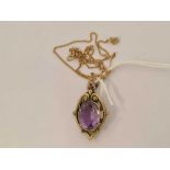 AN AMETHYST PENDANT SET IN 9ct ON FINE GOLD CHAIN