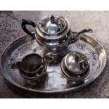 AN OVAL WHITE METAL TRAY WITH A TEA POT,