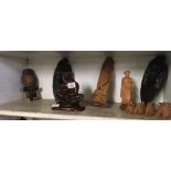 SHELF OF WOODEN ETHNIC ORNAMENTS