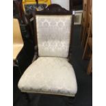 EDWARDIAN MAHOGANY FRAMED & UPHOLSTERED EASY CHAIR WITH ORIGINAL CASTERS
