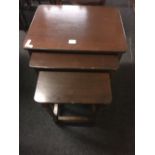 SMALL POLISHED OAK NEST OF 3 TABLES,