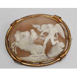 YELLOW METAL CARVED CAMEO BROOCH, ANGEL & HORSES, 28.